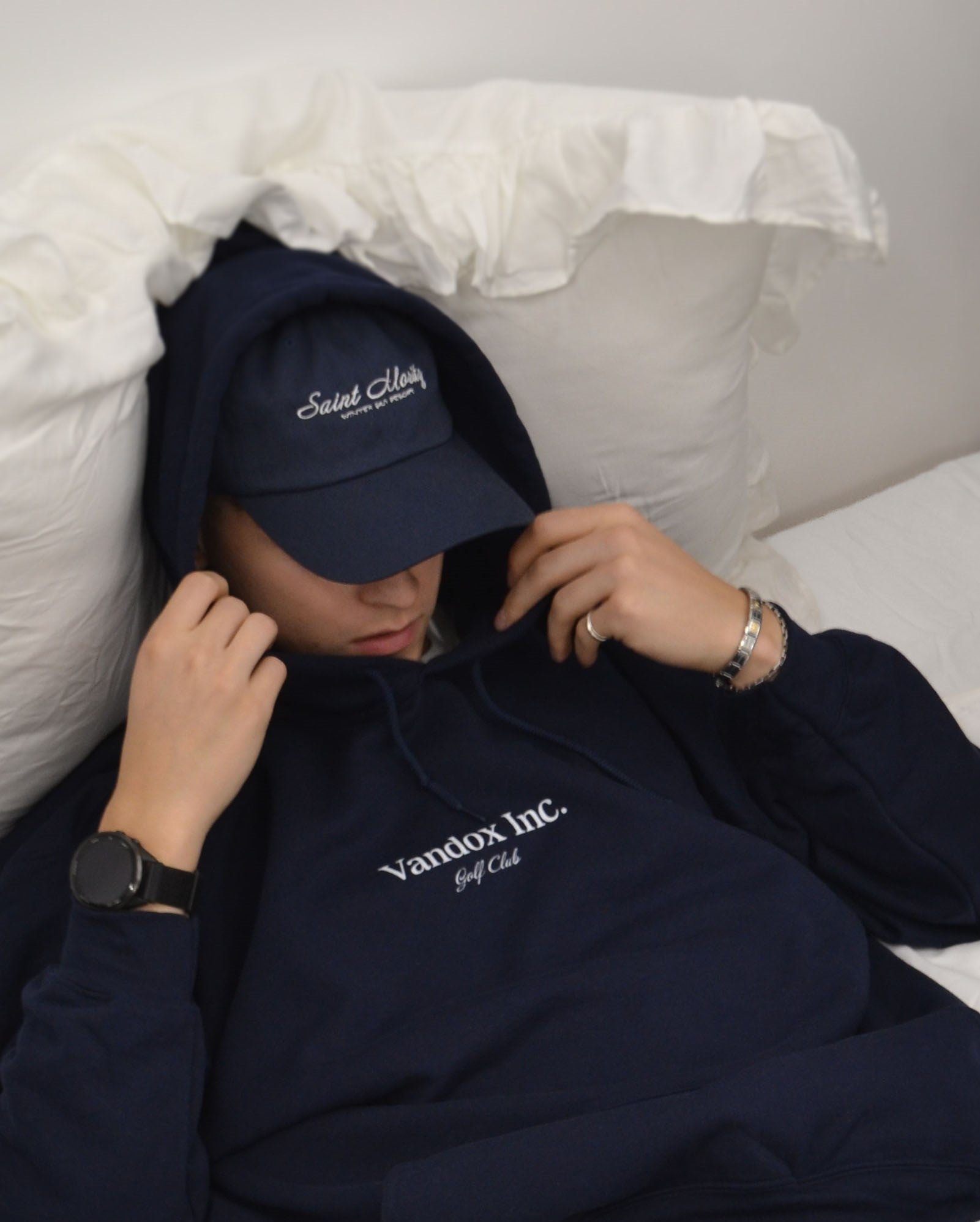 Male model wearing the Vandox Stockholm Hoodie in navy - a premium oversized hoodie with the “Vandox Inc. Golf Club” embroidery, styled effortlessly with the Alpine Escape Cap in matching navy. A refined, cozy essential blending old-money minimalism with modern streetwear elegance. Starboy old money hoodie sweatshirt clothes vandox sacrevandox vandox clothes vandox clothing