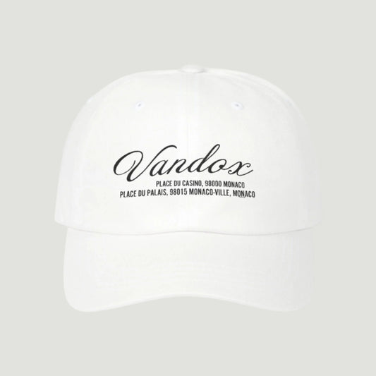 White Vandox cap featuring black embroidered script and Monaco location coordinates from the SS25 collection. Hat Cap Baseball Cap Baseball Hat starboy hat old money hats vandox sacre vandox sacrevandox vandox clothing vintage distressed baseball hat 