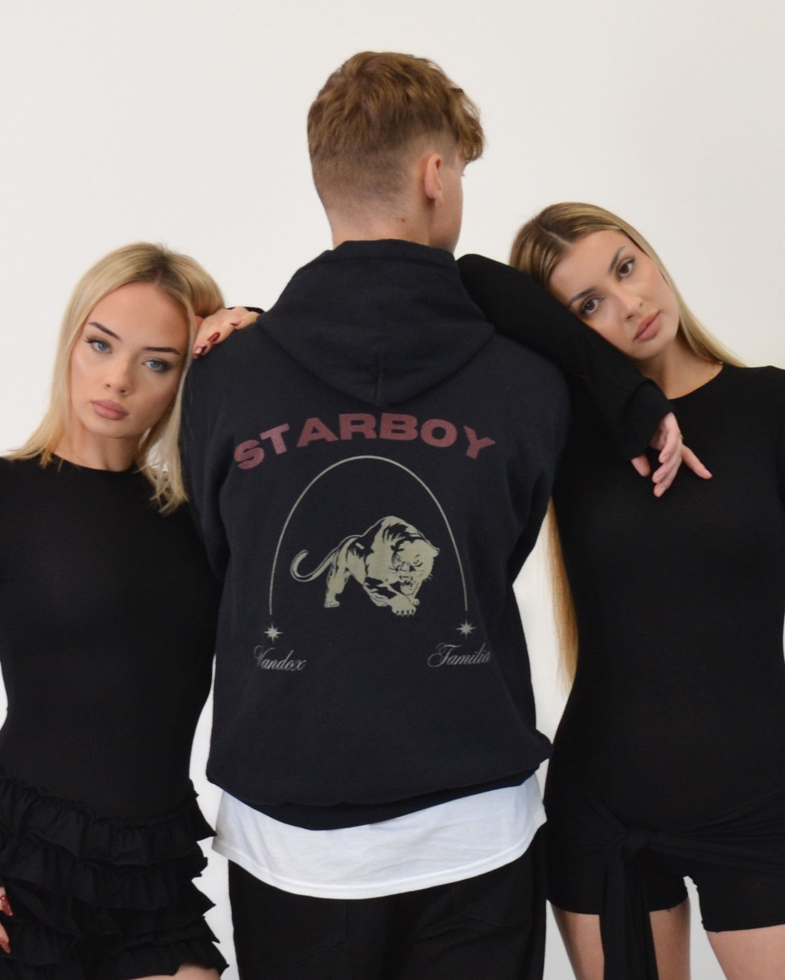 Model wearing the Starboy Hoodie in black by Vandox - a bold oversized hoodie featuring the signature prowling tiger and arched lettering. A statement streetwear piece from the Vandox Famille collection, merging power, allure, and effortless luxury. Starboy old money hoodie sweatshirt clothes vandox sacrevandox vandox clothes vandox clothing
