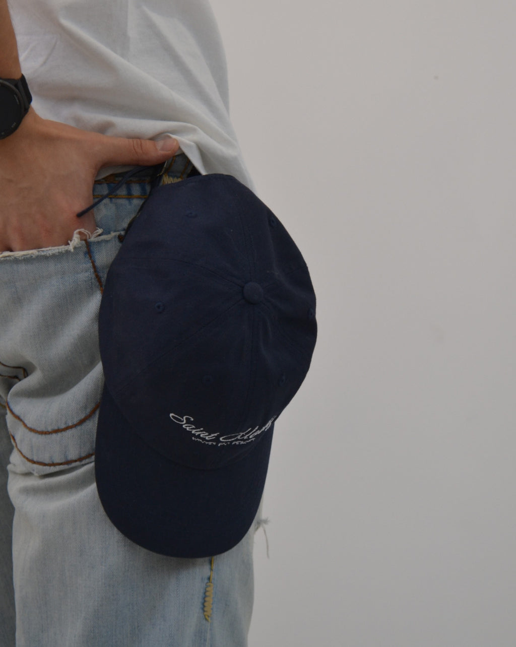 Close-up of the Alpine Escape Cap in navy - a minimalist Vandox baseball cap embroidered with “Saint Moritz Winter Ski Resort.” Crafted from premium cotton with a curved brim, adjustable strap, and timeless alpine-inspired aesthetic — the perfect finishing touch for elevated casual and après-ski looks. Hat Cap Baseball Cap Baseball Hat starboy hat old money hats vandox sacre vandox sacrevandox vandox clothing