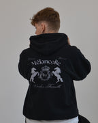 Model wearing the Mélancolie Hoodie in black by Vandox - a premium oversized hoodie featuring the signature Vandox Famille crest. A timeless piece blending aristocratic heritage with modern streetwear sophistication. Starboy old money hoodie sweatshirt clothes vandox sacrevandox vandox clothes vandox clothing