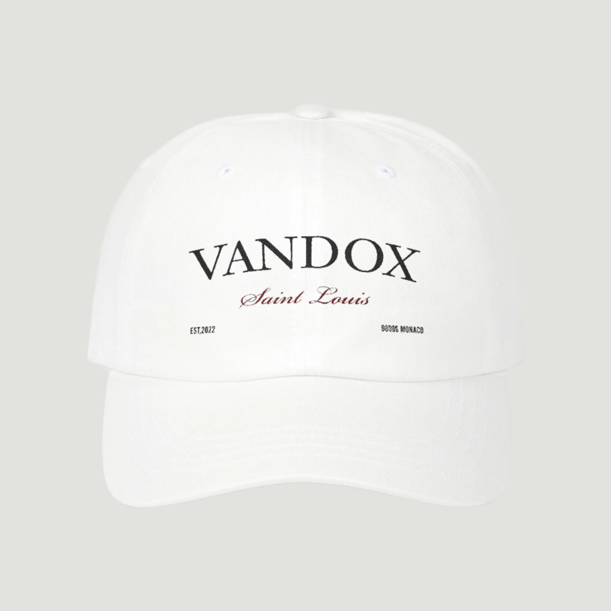 White Vandox cap with black logo, red “Saint Louis” script, Monaco postal code, and EST.2022 detail, part of the SS25 collection. Hat Cap Baseball Cap Baseball Hat starboy hat old money hats vandox sacre vandox sacrevandox vandox clothing vintage distressed baseball hat 