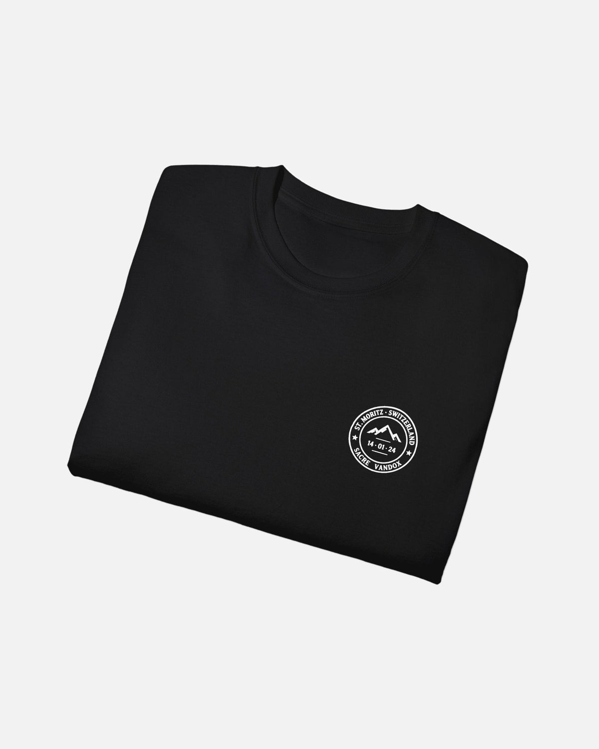 Black Vandox Powder Day t-shirt folded front view with red St. Moritz Switzerland circular stamp and Sacre Vandox chest graphic. Starboy old money shirt tshirt clothes vandox sacrevandox vandox clothes vandox clothing