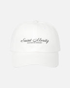 Front view of the eggshell white Vandox Alpine Summit Cap featuring embroidered "Saint Moritz Winter Ski Resort" text in elegant script. Hat Cap Baseball Cap Baseball Hat starboy hat old money hats vandox sacre vandox sacrevandox vandox clothing