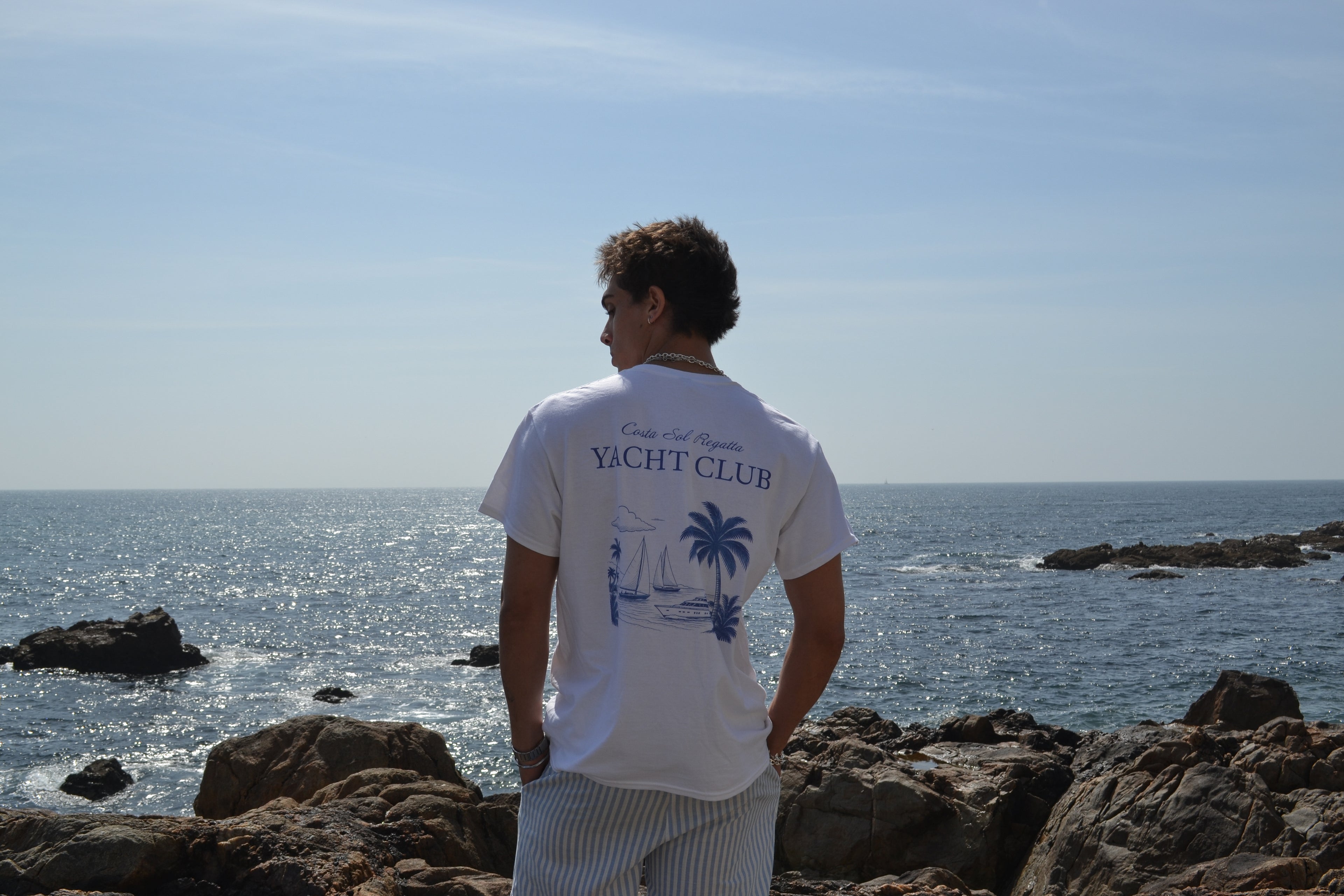 Main hero, model wearing vandox riviera regatta on seaside cliff