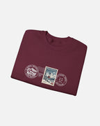 Folded view of Maroon Vandox Post Stamp crewneck sweatshirt with vintage Helvetia 80 postal stamp St. Moritz Engadin scene and Alpine Heritage Alpine Leisure Vandox postmark chest graphic. Starboy old money hoodie sweatshirt clothes vandox sacrevandox vandox clothes vandox clothing crewneck autumn clothes no hood fall clothes 