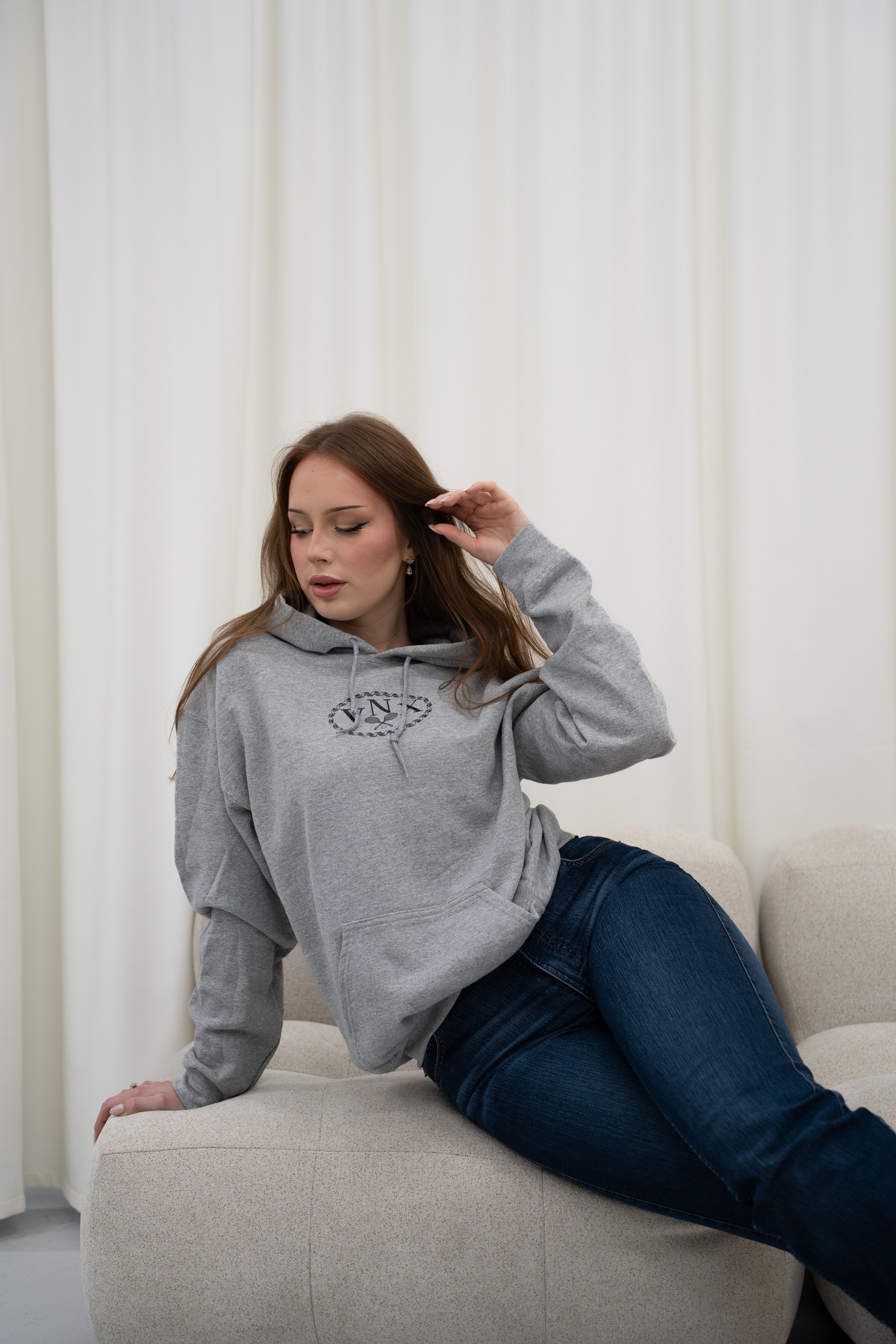 Model wearing Grey Sport Grey VANDOX Tennis Court Hoodie with VNX Vandox logo and tennis court design, casual luxury starboy old money aesthetic from Vandox clothing collection