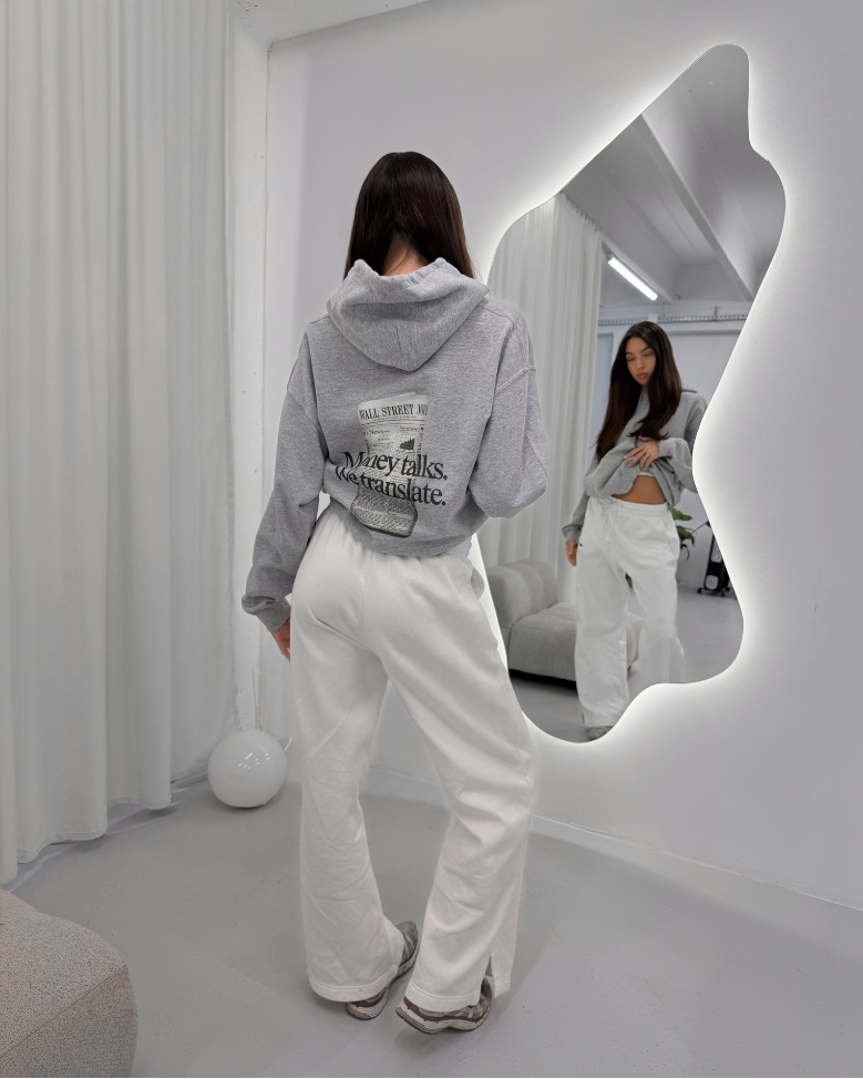 Female Model Wearing Vandox Sport Grey Money Talks Hoodie in front of a mirror
