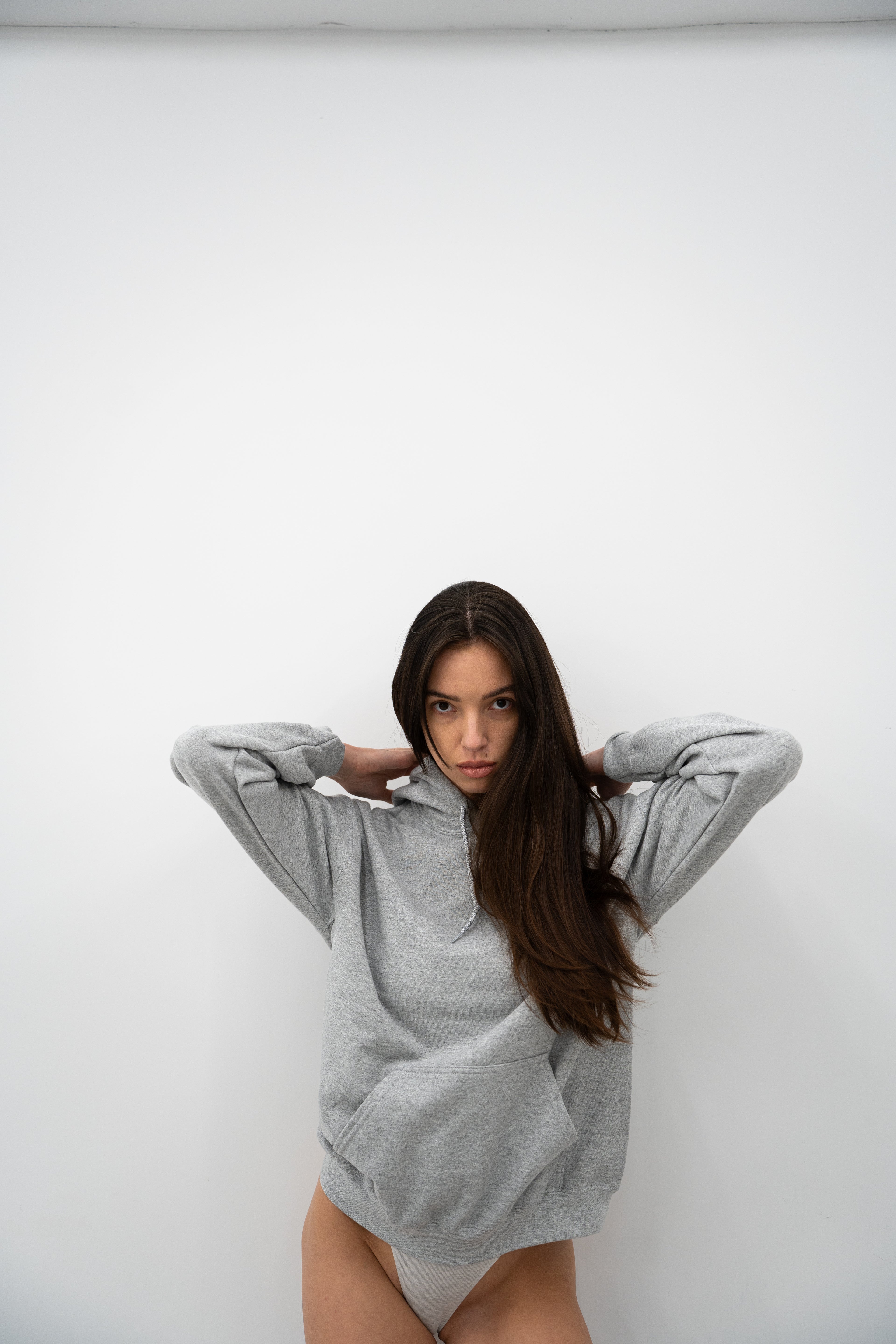 Model wearing Sport Grey Vandox Marlboro World Championship Team Hoodie, Formula 1 racing inspired hoodie from Vandox clothing collection, luxury starboy old money aesthetic streetwear brand