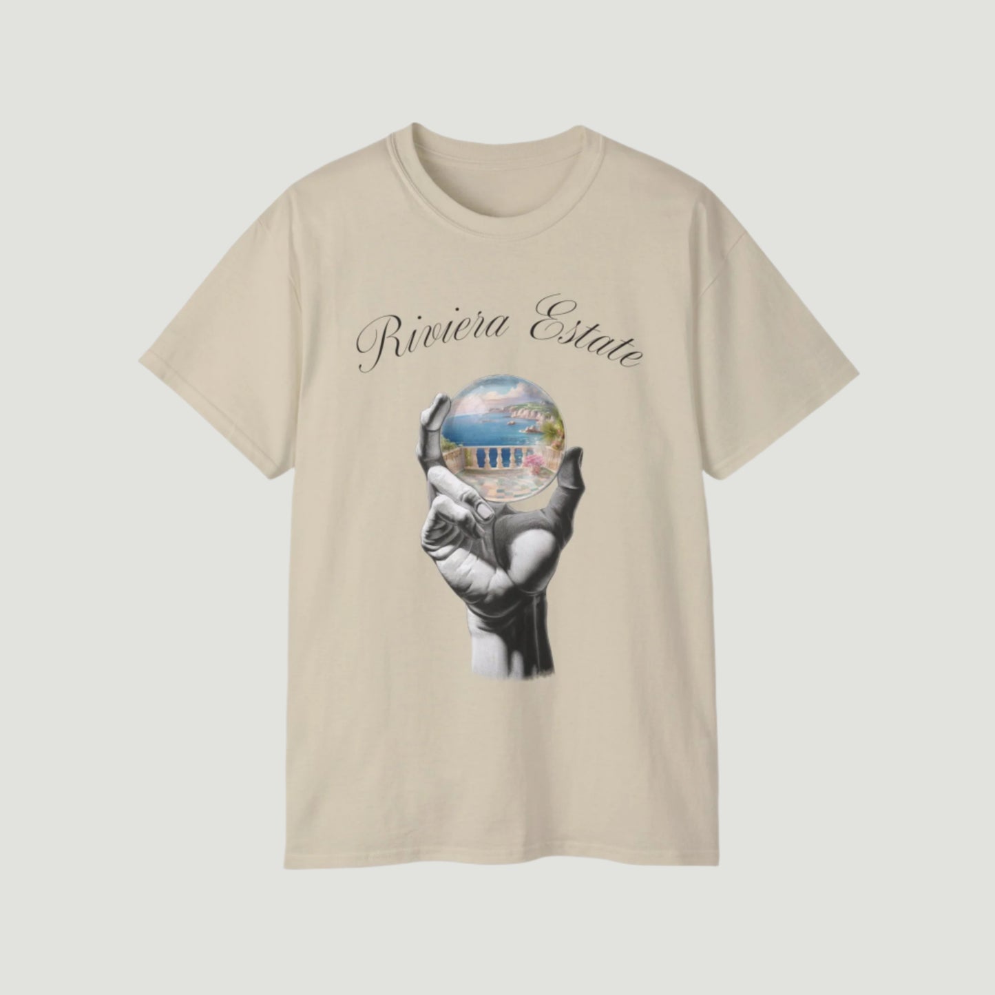 Sand Cream Beige Vandox Azure Prophecy Tee with graphic of a hand holding a crystal sphere showing a Riviera estate and “Riviera Estate” script. Starboy old money shirt tshirt clothes vandox sacrevandox vandox clothes vandox clothing