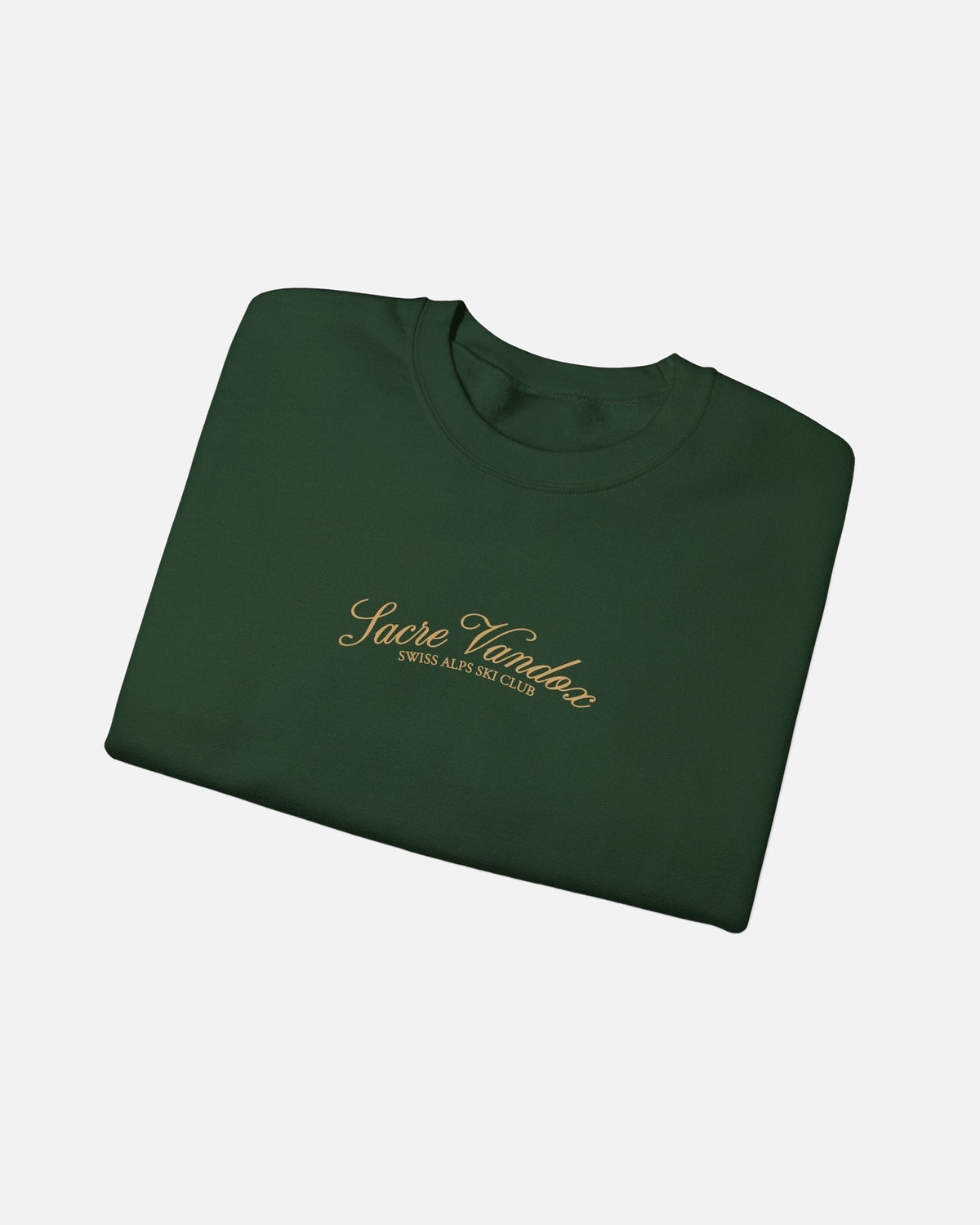 Folded view of Forest Green Vandox Chalet Edit crewneck sweatshirt with gold Sacre Vandox Swiss Alps Ski Club script chest graphic. Starboy old money hoodie sweatshirt clothes vandox sacrevandox vandox clothes vandox clothing crewneck autumn clothes no hood fall clothes 