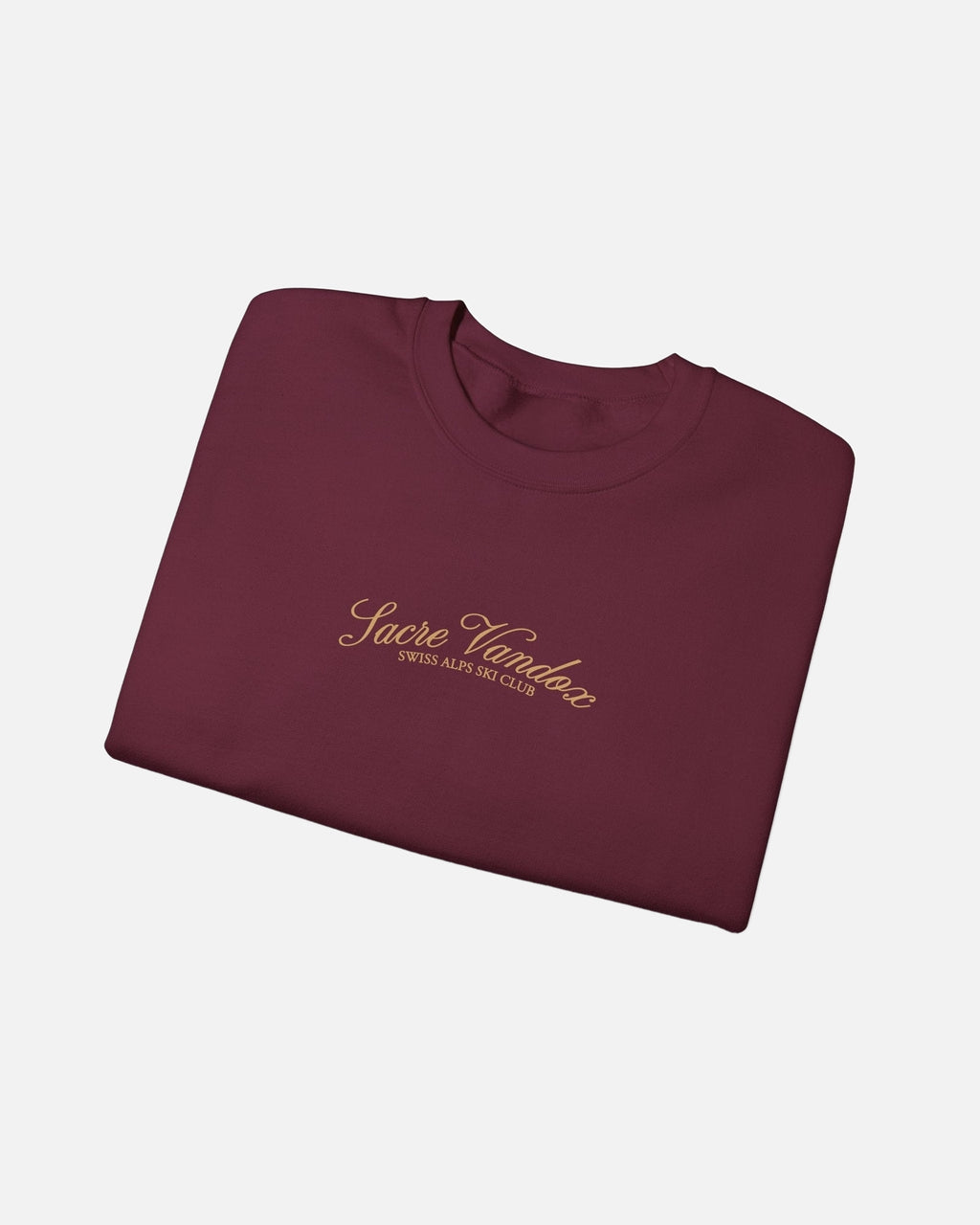 folded view of Maroon Vandox Chalet Edit crewneck sweatshirt with gold Sacre Vandox Swiss Alps Ski Club script chest graphic. Starboy old money hoodie sweatshirt clothes vandox sacrevandox vandox clothes vandox clothing crewneck autumn clothes no hood fall clothes 