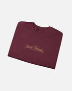 folded view of Maroon Vandox Chalet Edit crewneck sweatshirt with gold Sacre Vandox Swiss Alps Ski Club script chest graphic. Starboy old money hoodie sweatshirt clothes vandox sacrevandox vandox clothes vandox clothing crewneck autumn clothes no hood fall clothes 
