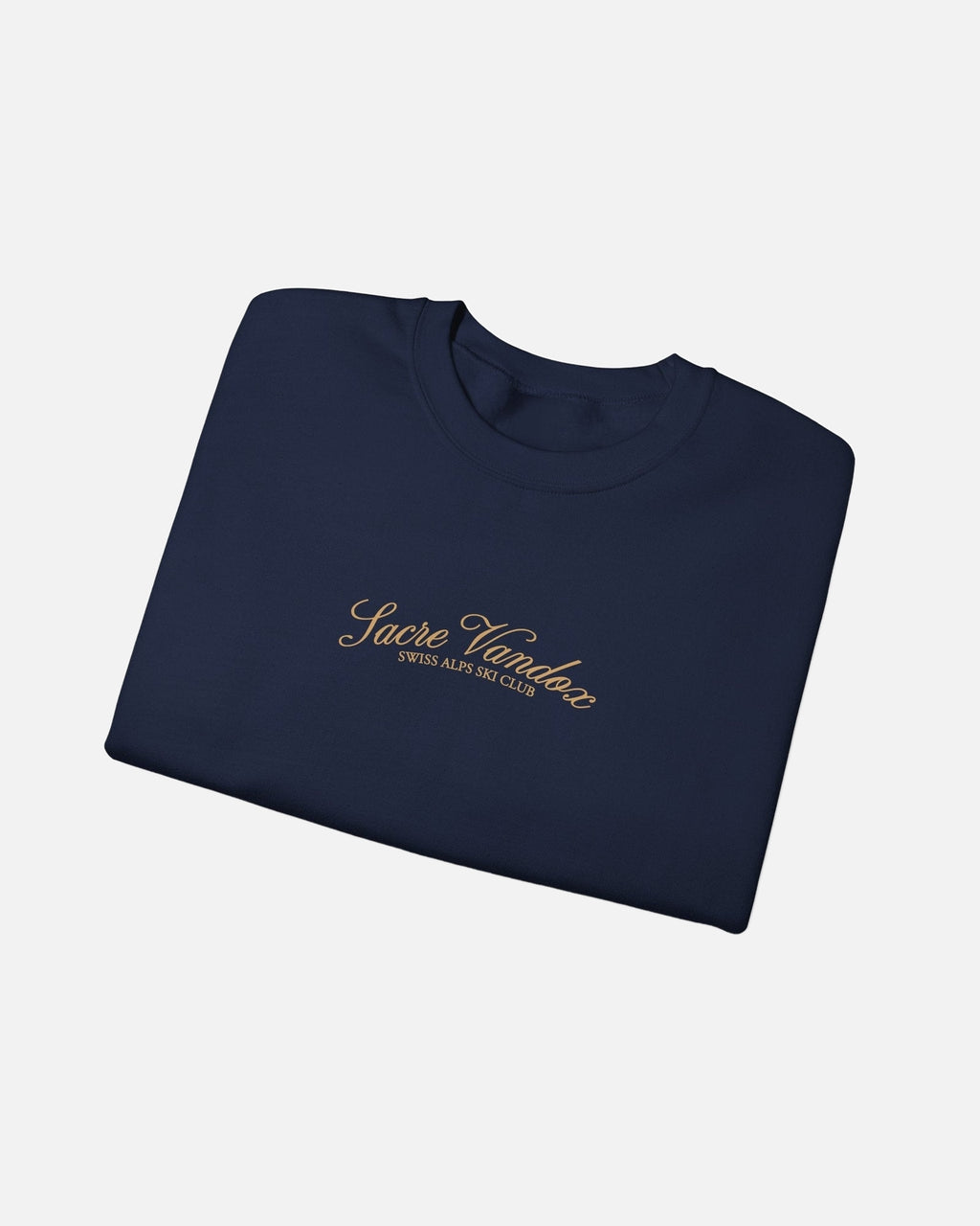 Folded view of Navy Vandox Chalet Edit crewneck sweatshirt with gold Sacre Vandox Swiss Alps Ski Club script chest graphic. Starboy old money hoodie sweatshirt clothes vandox sacrevandox vandox clothes vandox clothing crewneck autumn clothes no hood fall clothes 