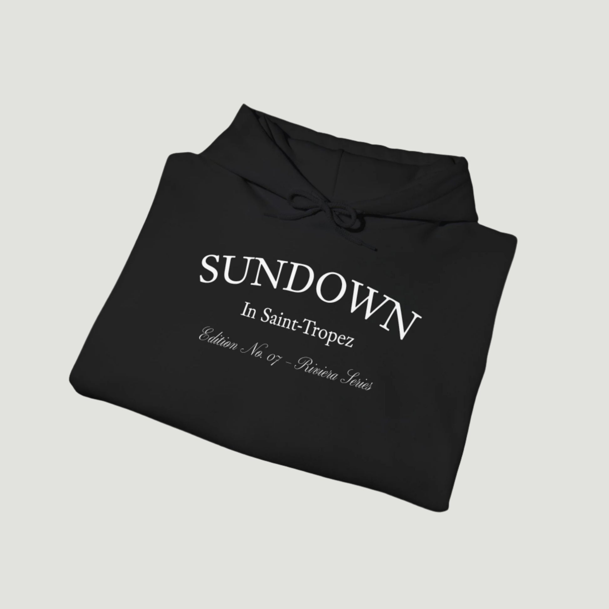 Folded view of Deep Dark Citrus Sunset Hoodie featuring Saint-Tropez citrus plate graphic and Sundown script from Vandox SS25 Collection. Starboy old money hoodie sweatshirt clothes vandox sacrevandox vandox clothes vandox clothing