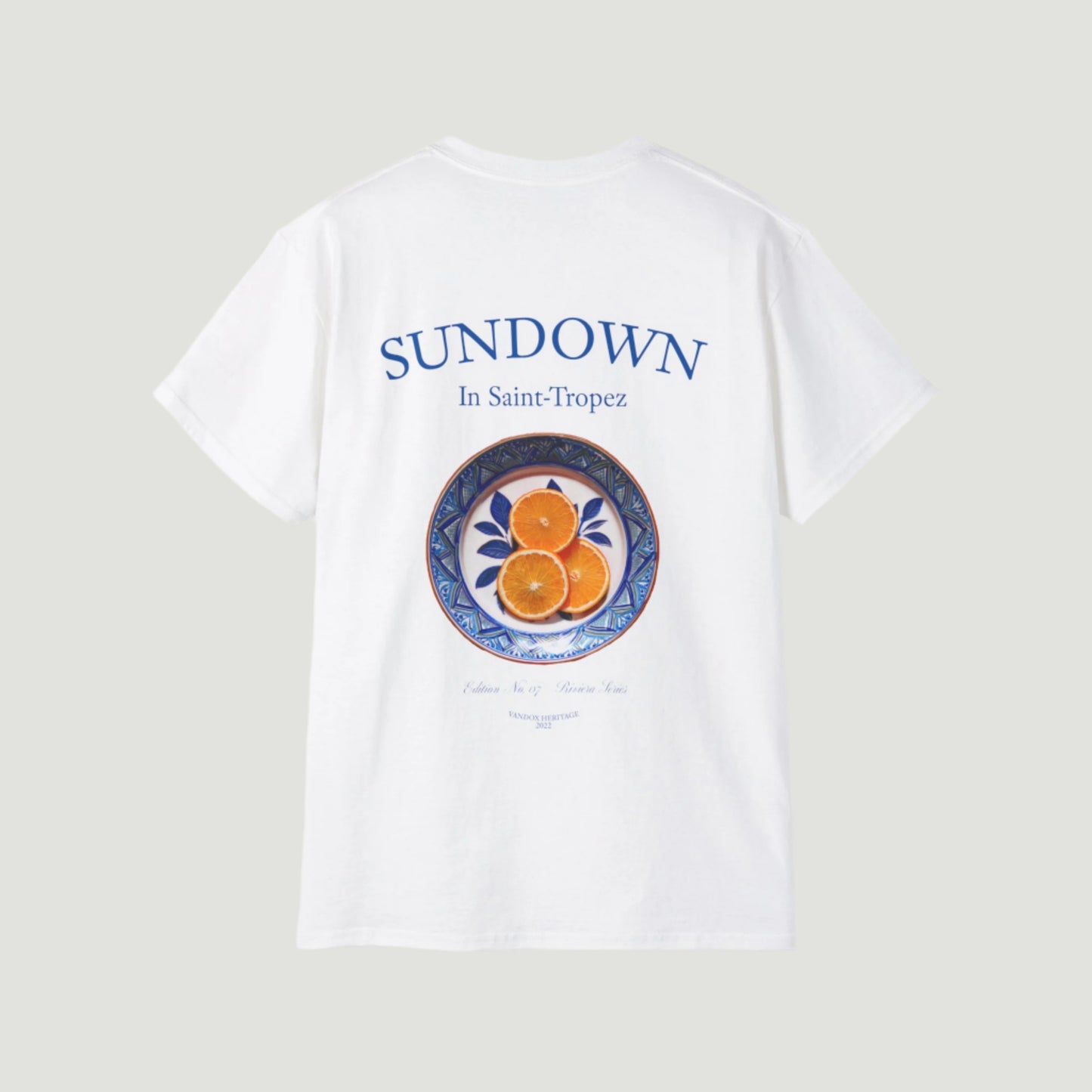 Eggshell White Vandox Citrus Sunset T-Shirt with small Saint-Tropez “Sundown” chest print and large back graphic of oranges on a Mediterranean plate. Starboy old money shirt tshirt clothes vandox sacrevandox vandox clothes vandox clothing