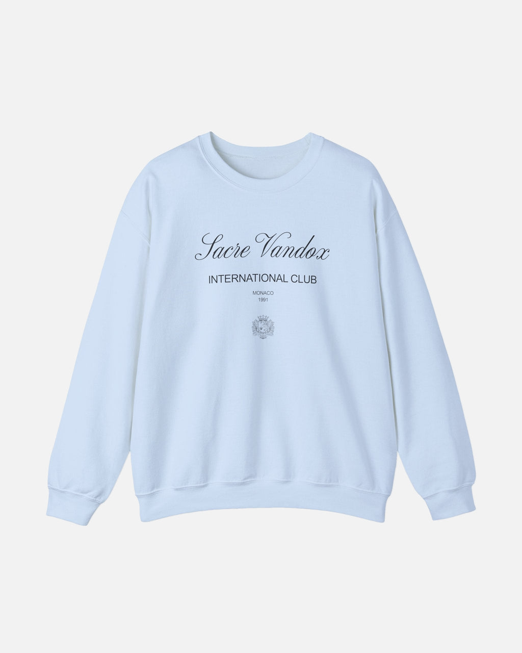 Light Blue baby blue Vandox Le Rocher Crewneck, front view with Sacre Vandox script, International Club Monaco 1991 text and small crest, luxury streetwear crewneck. Starboy old money crewneck sweatshirt clothes vandox sacrevandox vandox clothes vandox clothing
