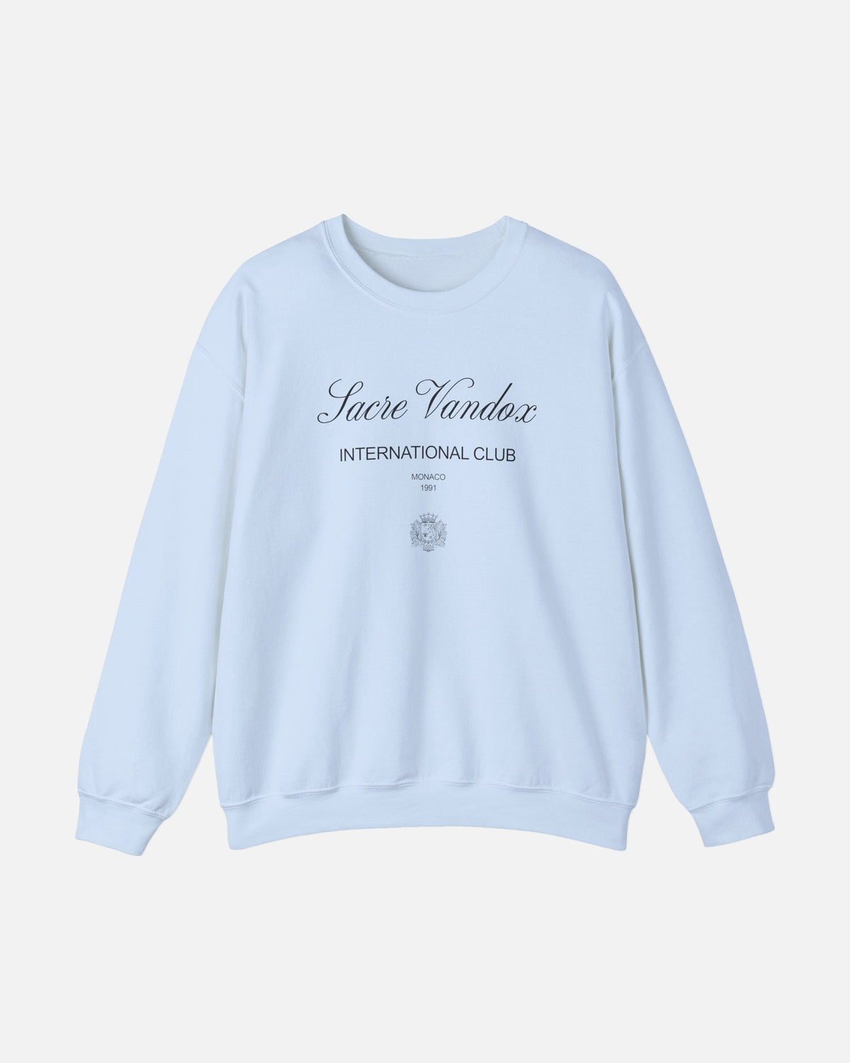 Light Blue baby blue Vandox Le Rocher Crewneck, front view with Sacre Vandox script, International Club Monaco 1991 text and small crest, luxury streetwear crewneck. Starboy old money crewneck sweatshirt clothes vandox sacrevandox vandox clothes vandox clothing