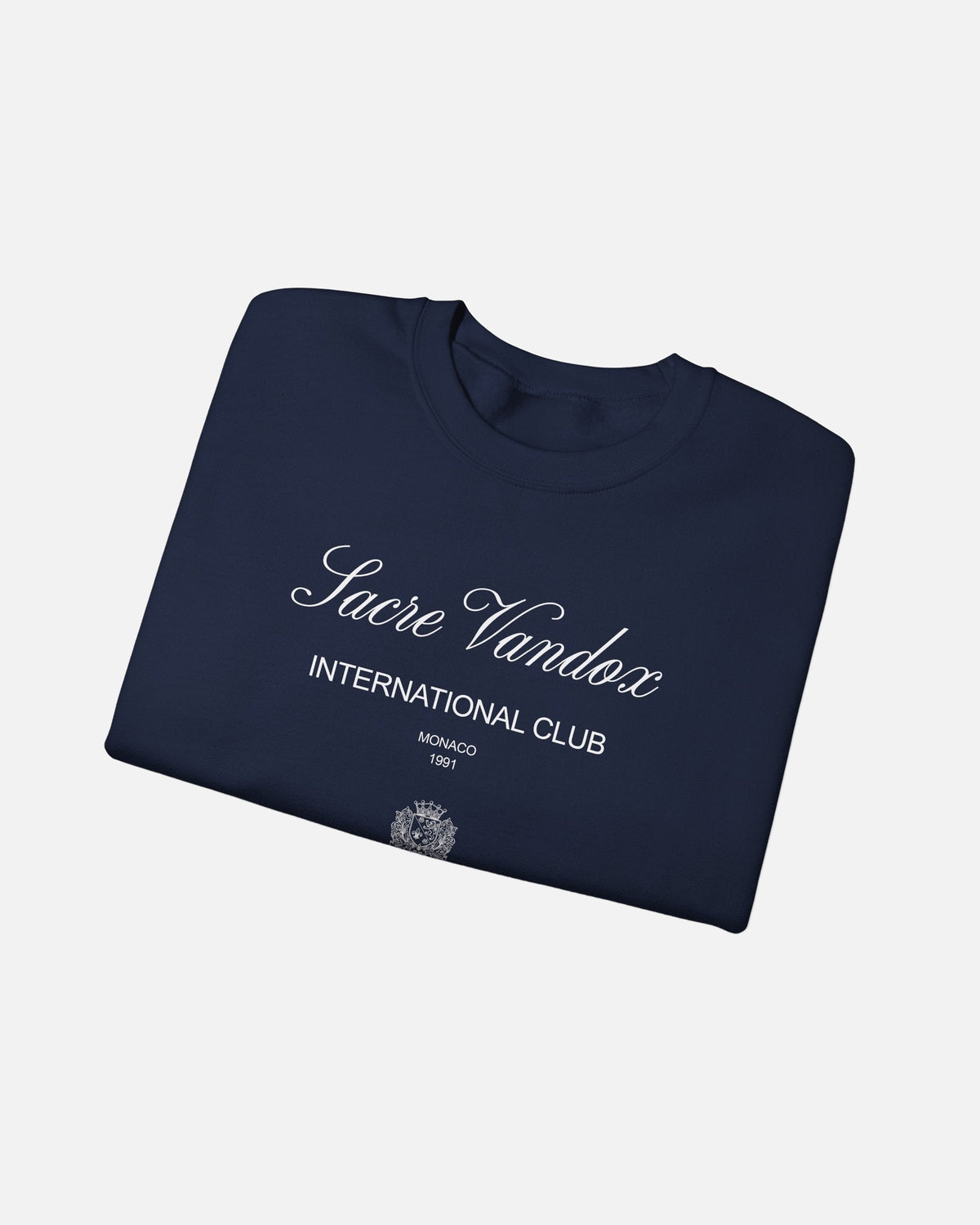 Navy dark blue deep blue Vandox Le Rocher Crewneck, folded front view with Sacre Vandox script, International Club Monaco 1991 text and small crest, luxury streetwear crewneck. Starboy old money crewneck sweatshirt clothes vandox sacrevandox vandox clothes vandox clothing