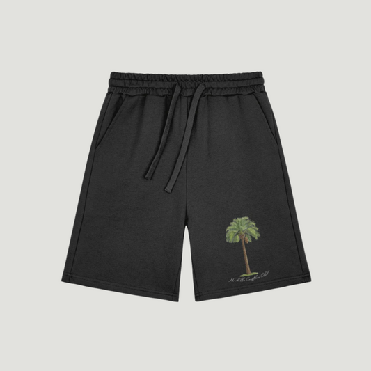 Deep Black Vandox Palm Royale cotton shorts with embroidered green palm tree and “Monte Carlo, 1985” script on the left leg, drawstring waistband and side pockets – Vandox Palm Royale Shorts. Starboy old money shorts pants bottoms clothes vandox sacrevandox vandox clothes vandox clothing