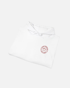 Eggshell White Vandox Powder Day hoodie front folded view with red St. Moritz Switzerland circular stamp and Sacre Vandox chest graphic. Starboy old money hoodie sweatshirt clothes vandox sacrevandox vandox clothes vandox clothing