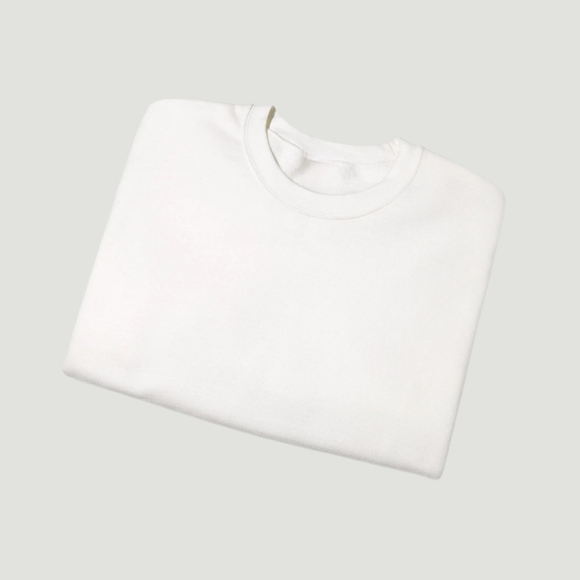 Folded view of Eggshell White Saint Tropez Crewneck from Vandox SS25 Collection featuring signature script logo and clean minimal aesthetic. Starboy old money hoodie sweatshirt clothes vandox sacrevandox vandox clothes vandox clothing crewneck