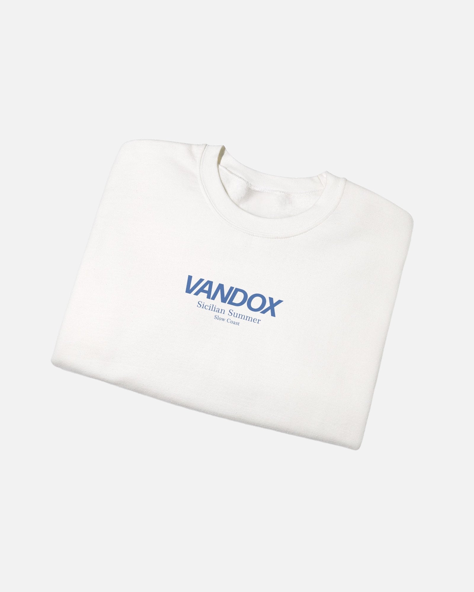 Folded View of White crewneck sweatshirt with blue VANDOX Sicilian Summer Slow Coast front graphic. Starboy old money hoodie sweatshirt clothes vandox sacrevandox vandox clothes vandox clothing crewneck