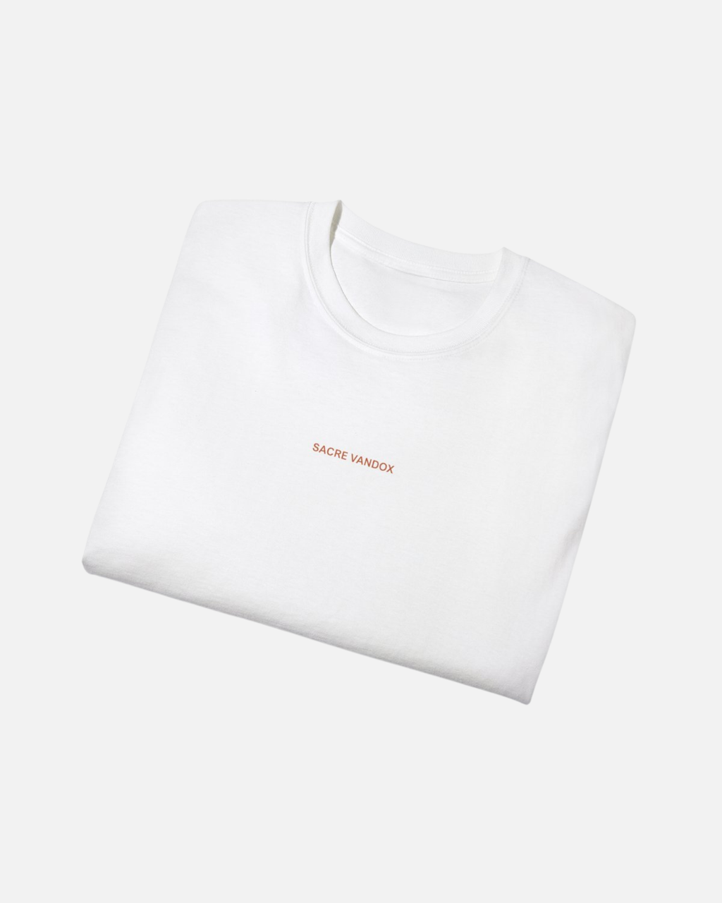 Folded view of Vandox Ski Club Poster White t-shirt with Sacre Vandox red wordmark chest graphic. Starboy old money shirt tshirt clothes vandox sacrevandox vandox clothes vandox clothing