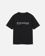 Front view of Dark Black  Vandox Stockholm t-shirt with distressed STOCKHOLM Sacre Vandox ESTD 2022 front graphic print. Starboy old money shirt tshirt clothes vandox sacrevandox vandox clothes vandox clothing