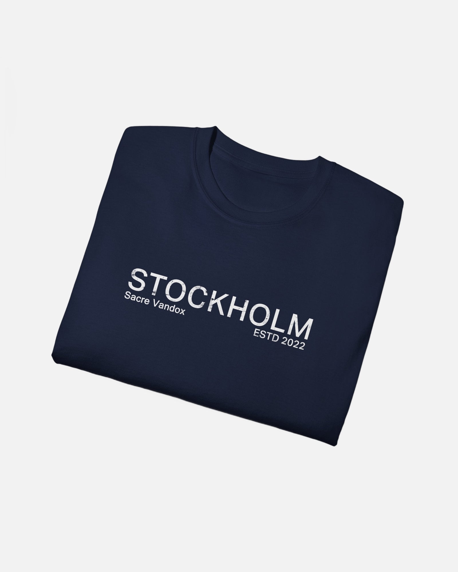 Folded view of Navy Vandox Stockholm t-shirt with distressed STOCKHOLM Sacre Vandox ESTD 2022 front graphic print. Starboy old money shirt tshirt clothes vandox sacrevandox vandox clothes vandox clothing