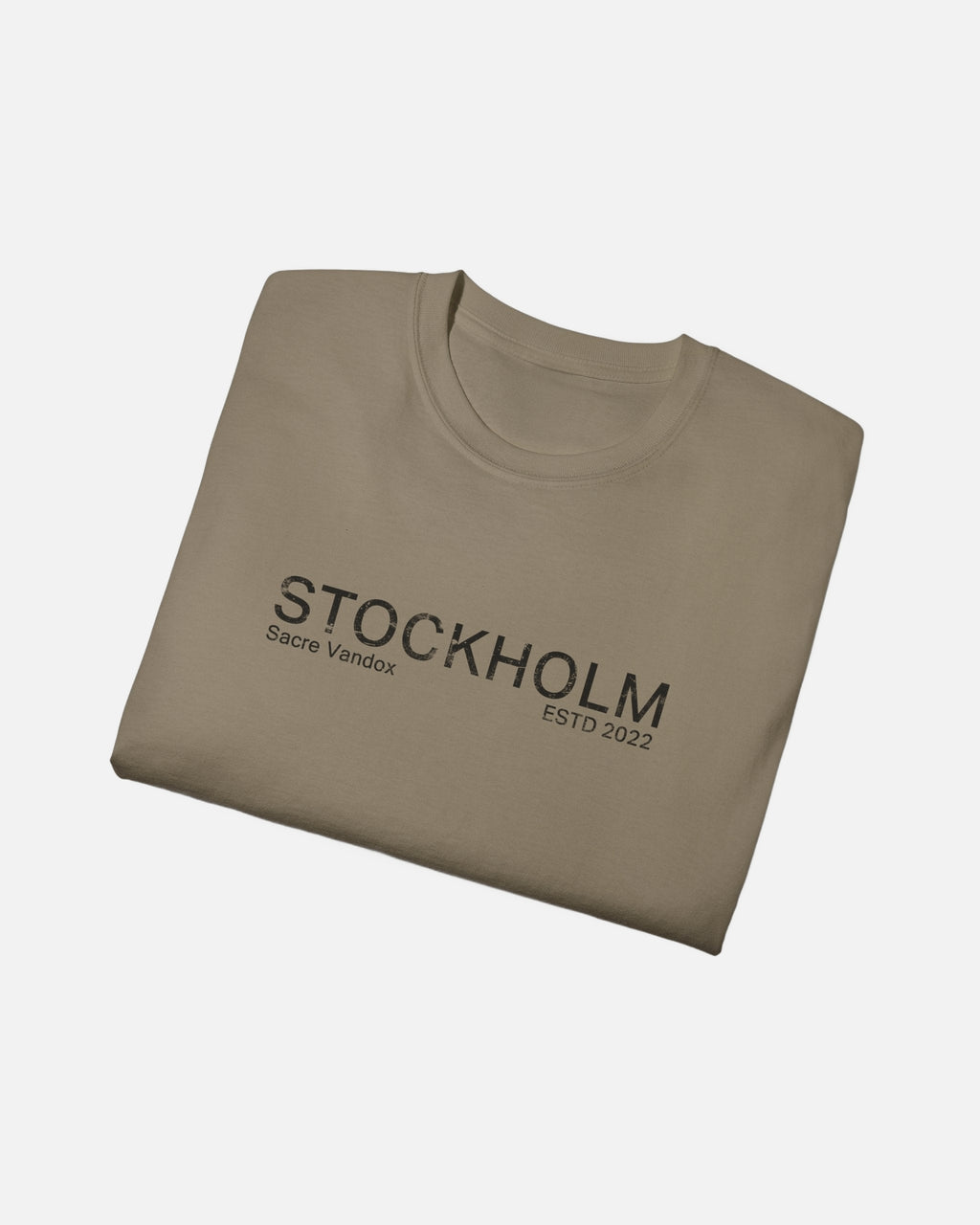 Folded view of Prairie Dust Vandox Stockholm t-shirt with distressed STOCKHOLM Sacre Vandox ESTD 2022 front graphic print. Starboy old money shirt tshirt clothes vandox sacrevandox vandox clothes vandox clothing