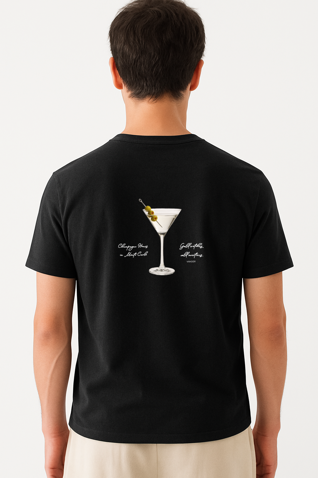 Model wearing the Vandox Black Vesper Society T-Shirt featuring a martini glass with olives and handwritten-style text, combining luxury cocktail culture with starboy fashion by Vandox.