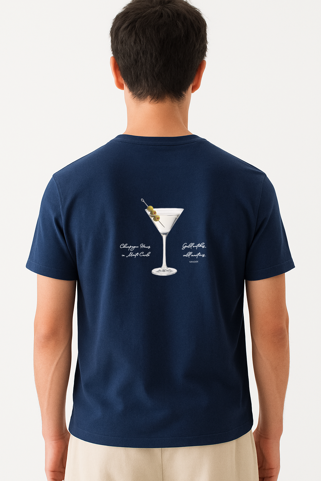 Model wearing the Vandox Navy Vesper Society T-Shirt featuring a martini glass with olives and handwritten-style text, combining luxury cocktail culture with starboy fashion by Vandox.