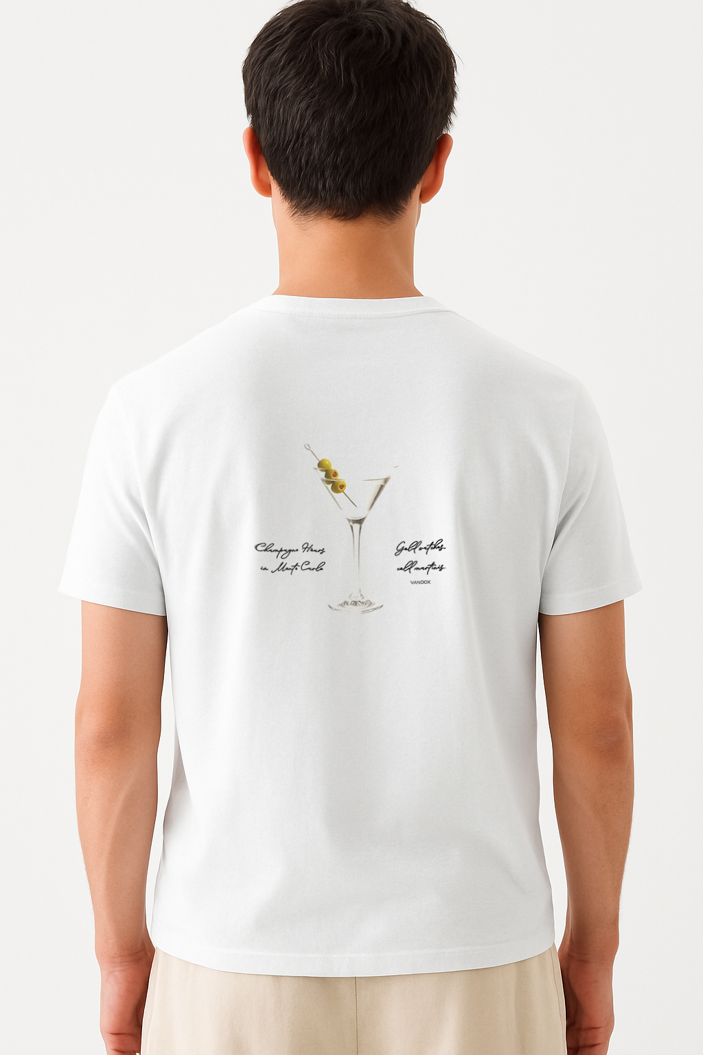 Model wearing the Vandox White Vesper Society T-Shirt featuring a martini glass with olives and handwritten-style text, combining luxury cocktail culture with starboy fashion by Vandox.