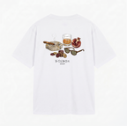 Back view of white oversized Vandox Vices t-shirt with illustrated cigar whisky poker chips sunglasses and pomegranate graphic and Vandox 2026 text. Cotton shirt tshirt clothes vandox riviera vandox 2026 vandox clothes vandox clothing