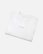 Folded view of White Vandox Swiss Alps Poster t-shirt with Sacre Vandox blue wordmark chest graphic. Starboy old money shirt tshirt clothes vandox sacrevandox vandox clothes vandox clothing
