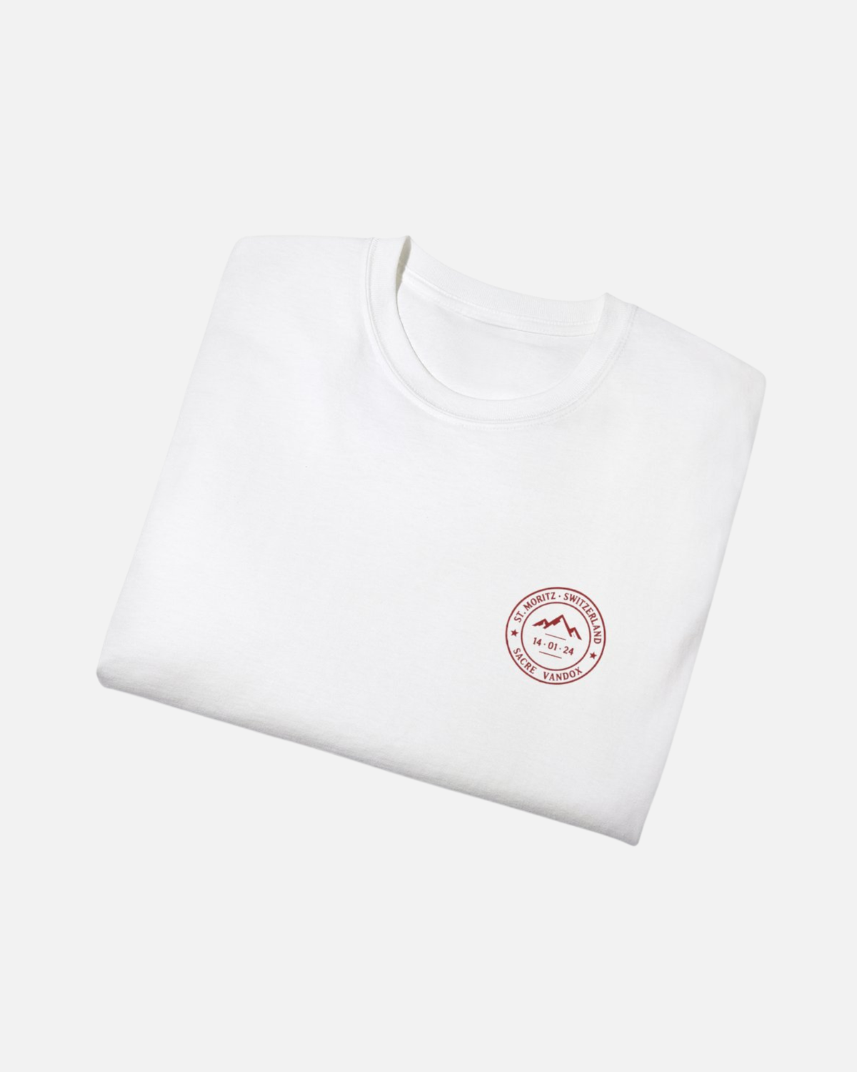 Eggshell White Vandox Powder Day t-shirt folded front view with red St. Moritz Switzerland circular stamp and Sacre Vandox chest graphic. Starboy old money shirt tshirt clothes vandox sacrevandox vandox clothes vandox clothing