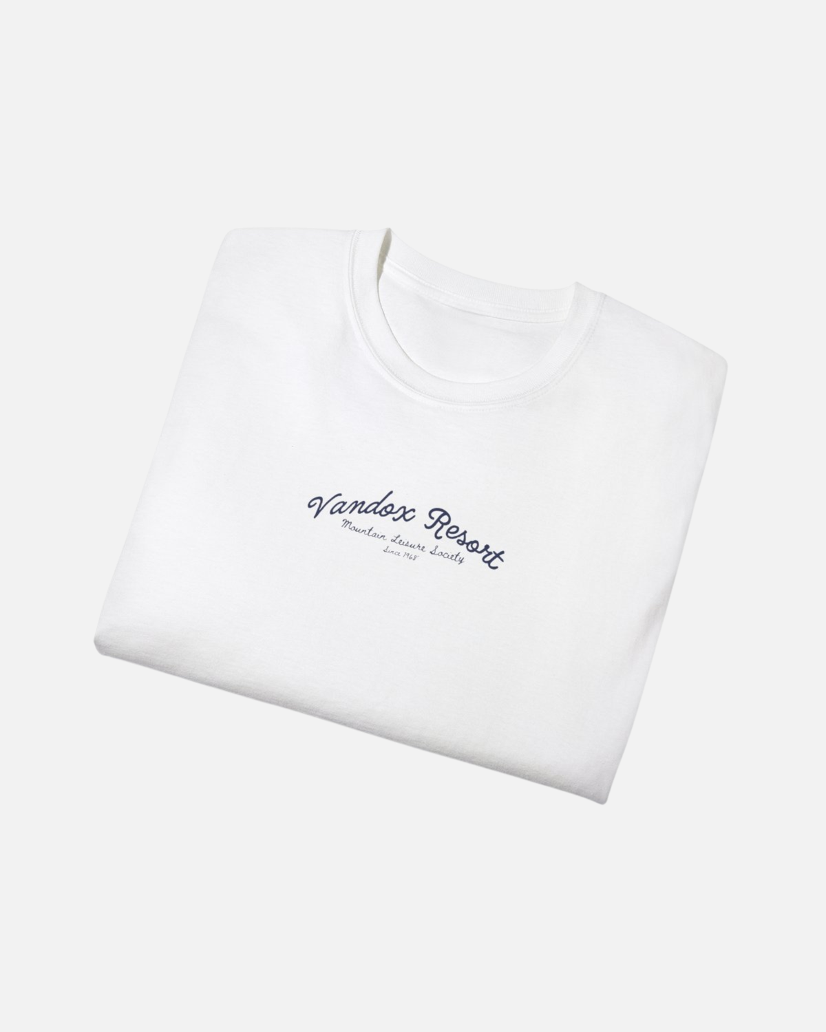 folded view of white egshell white offwhite Vandox Resort t-shirt with Vandox Resort Mountain Leisure Society script chest graphic. Starboy old money shirt tshirt clothes vandox sacrevandox vandox clothes vandox clothing